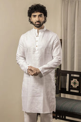 Model wearing 100% linen white kurta with mandarin collar, front view