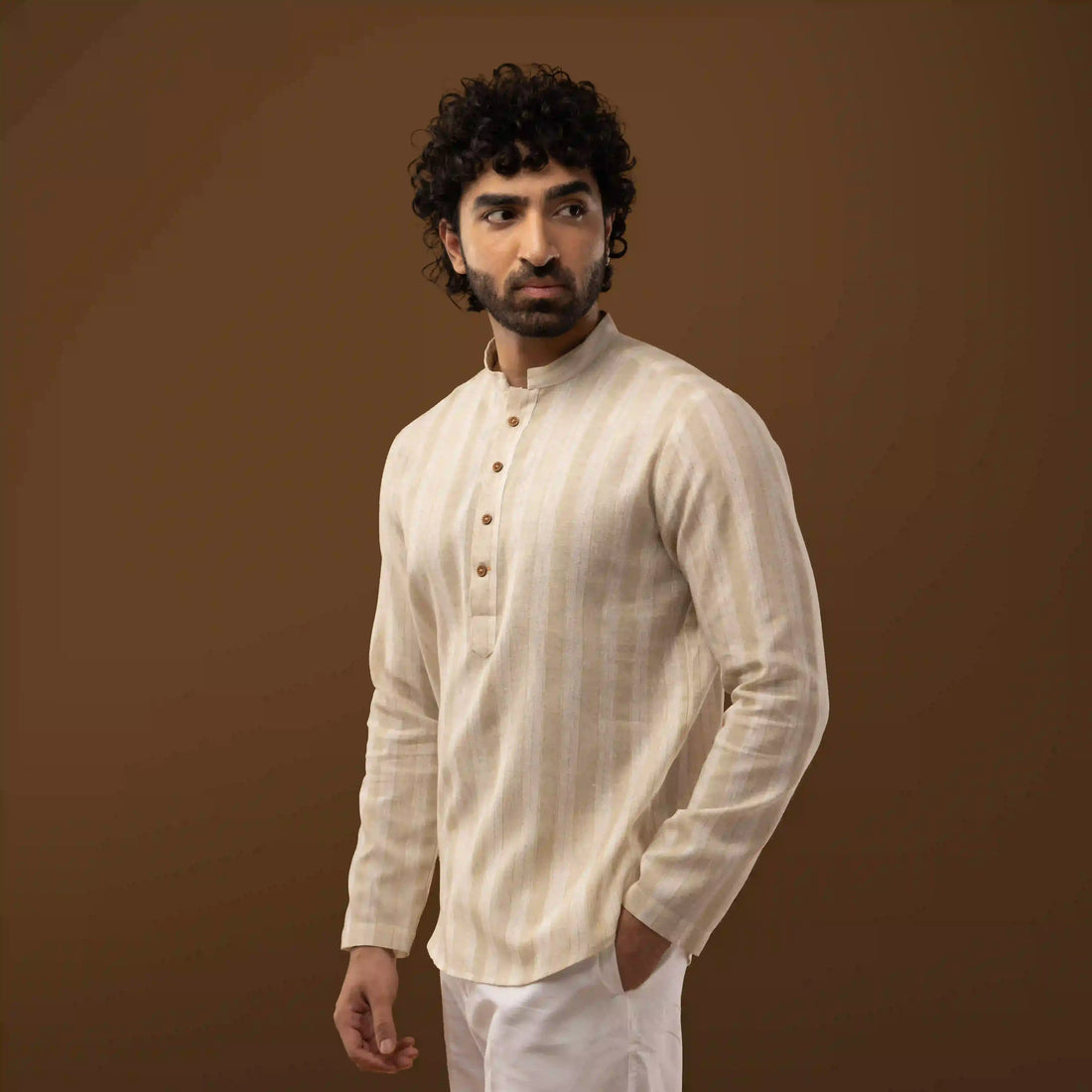 Side angle view of ivory Mandarin collar short kurta