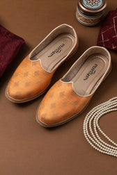 Top view of Handcrafted Orange Butta Printed Jutti with intricate design