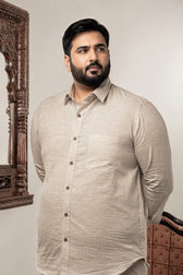 A 100% linen plain natural plus size shirt with full sleeves, wooden buttons, and a chest pocket.