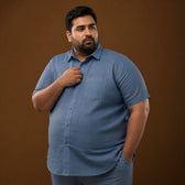 Model wearing steel blue 100% linen half sleeves shirt, plus size